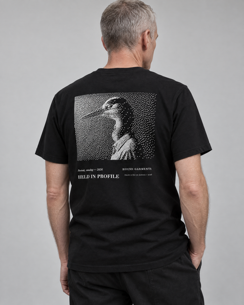 HELD IN PROFILE — editorial photograph